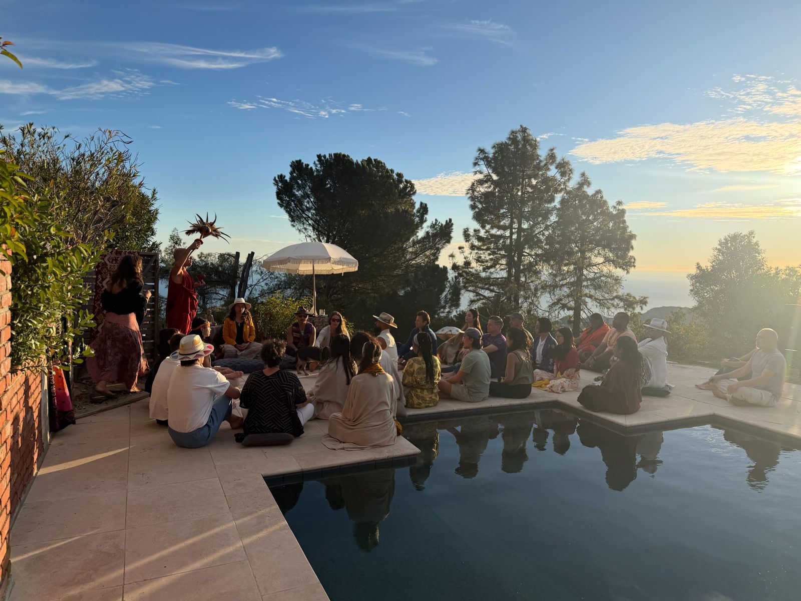 Group ceremony by the pool at sunset — Casa Topanga