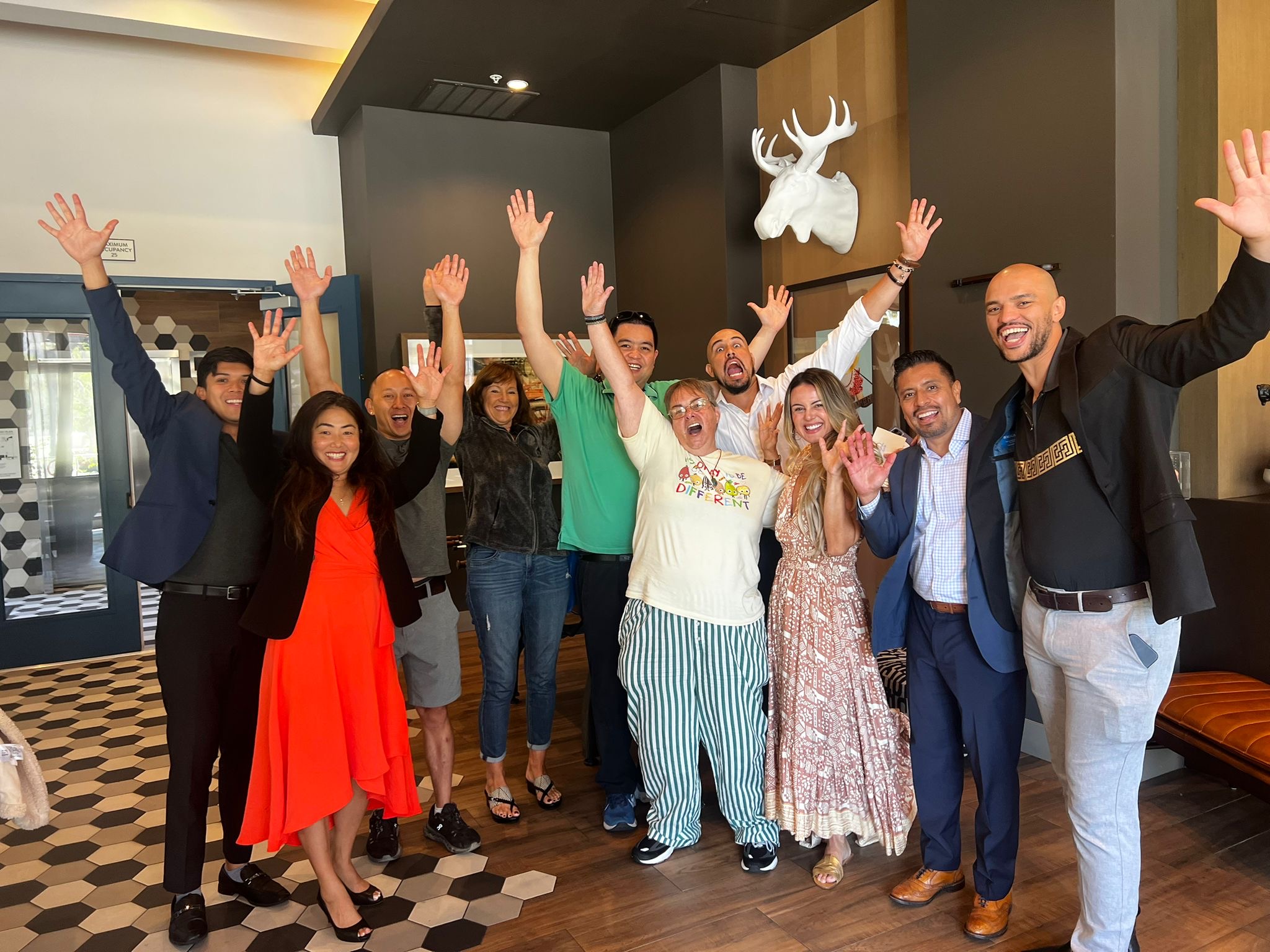 Hands raised, energy high — workshop community